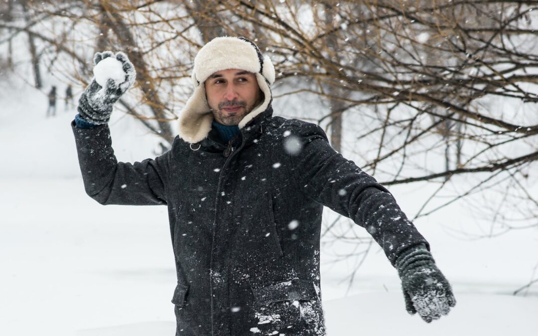 man holding snowball